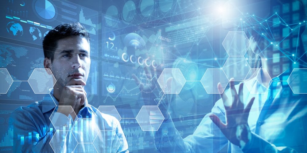 Businessman analysing financial charts hologram display and businesswoman using virtual reality glasses. Concept of financial management and teamwork.